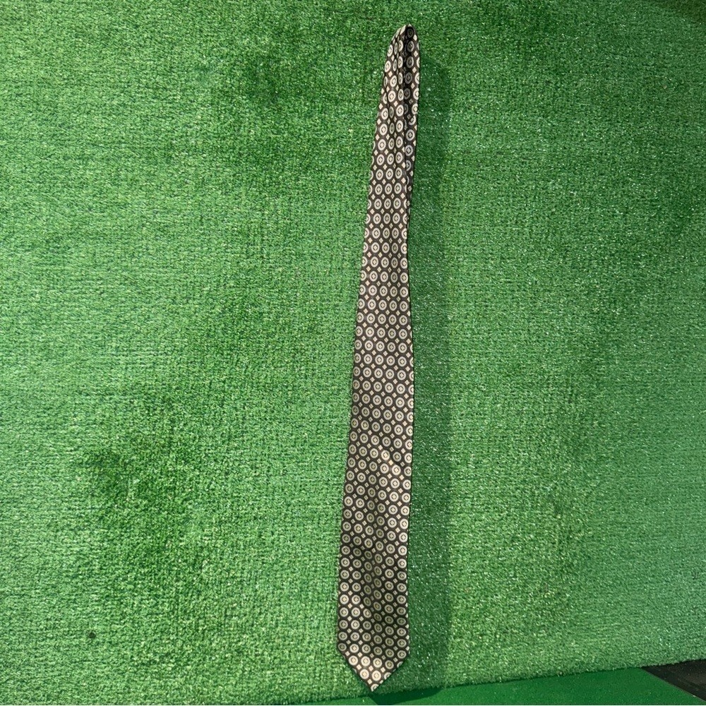 Chereskin patterned silk tie in brown and gold geometric design